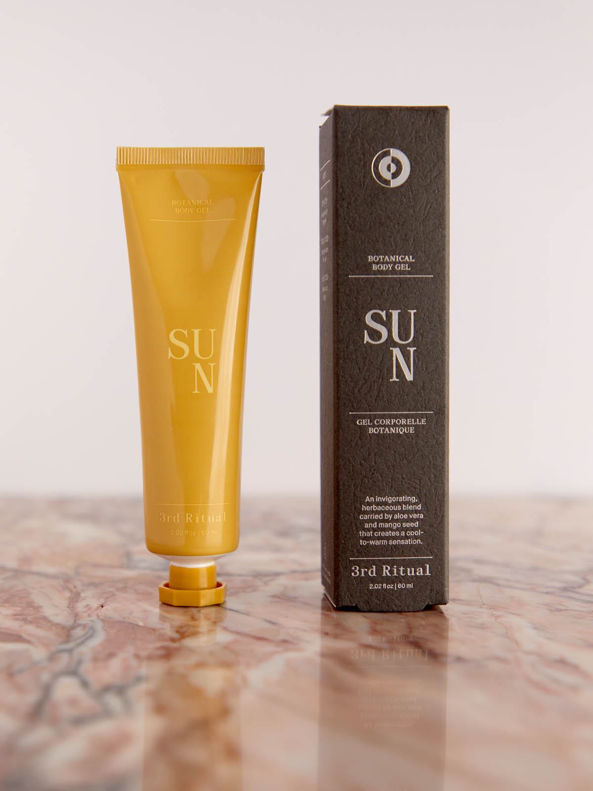 Sun Botanical Body Gel with box on pink marble