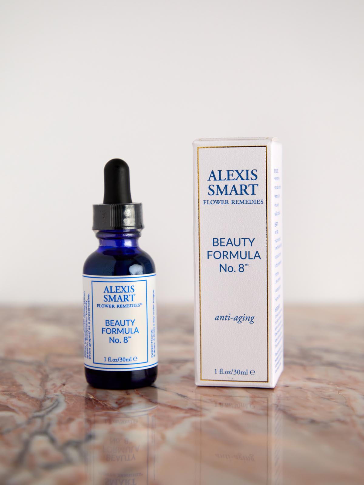 Beauty Formula No 8 with box on pink marble by Alexis Smart