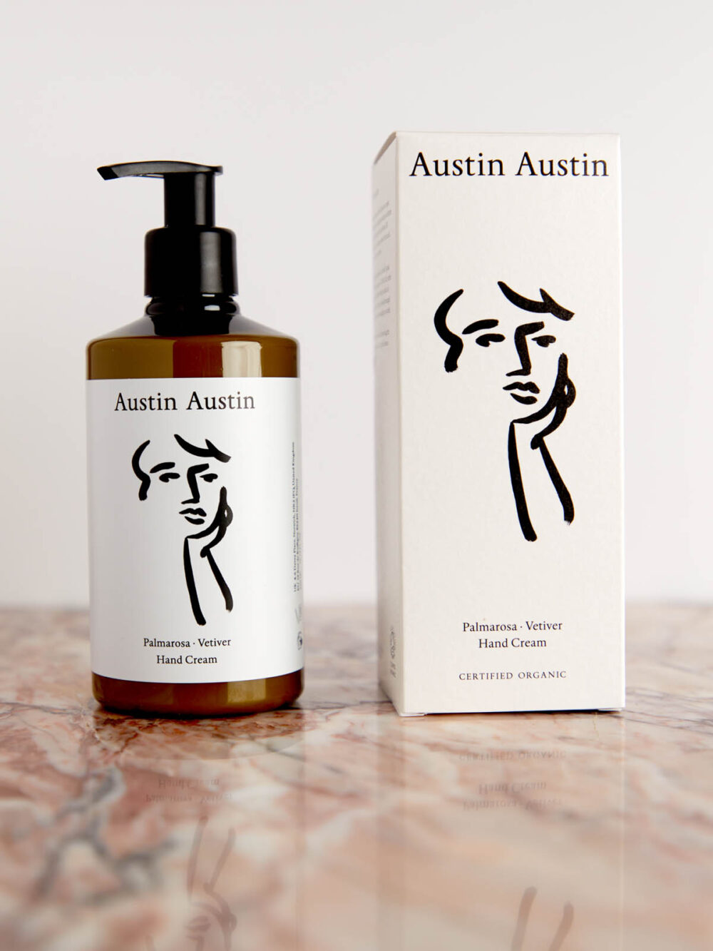 Palmarosa & Vetiver Hand Cream with box on pink marble by Austin Austin