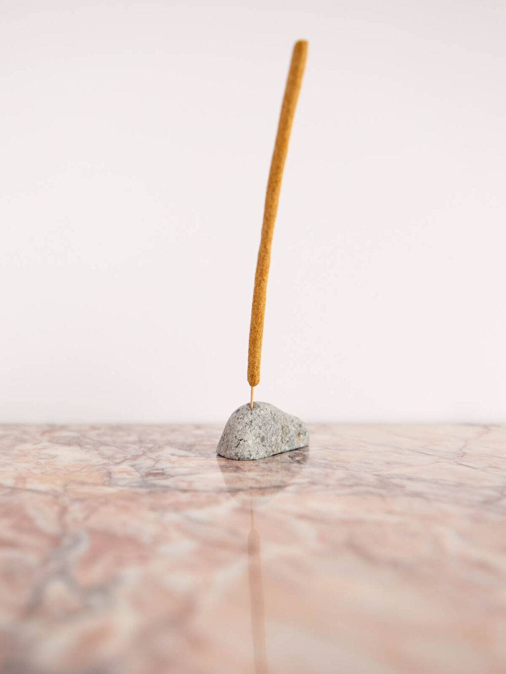 Rock Incense/Plant Holder by Cedar & Myrrh on pink marble with incense