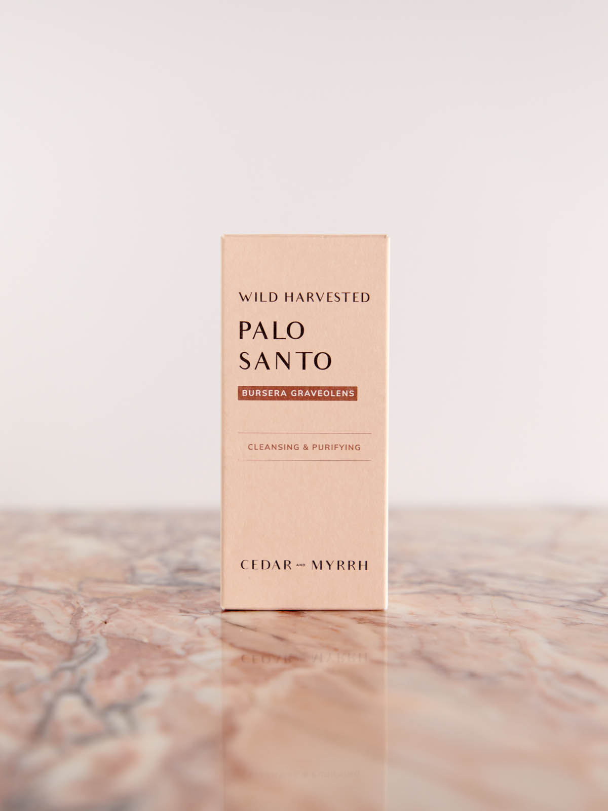 Sacred Palo Santo Sticks from Peru by Cedar & Myrrh box on pink marble