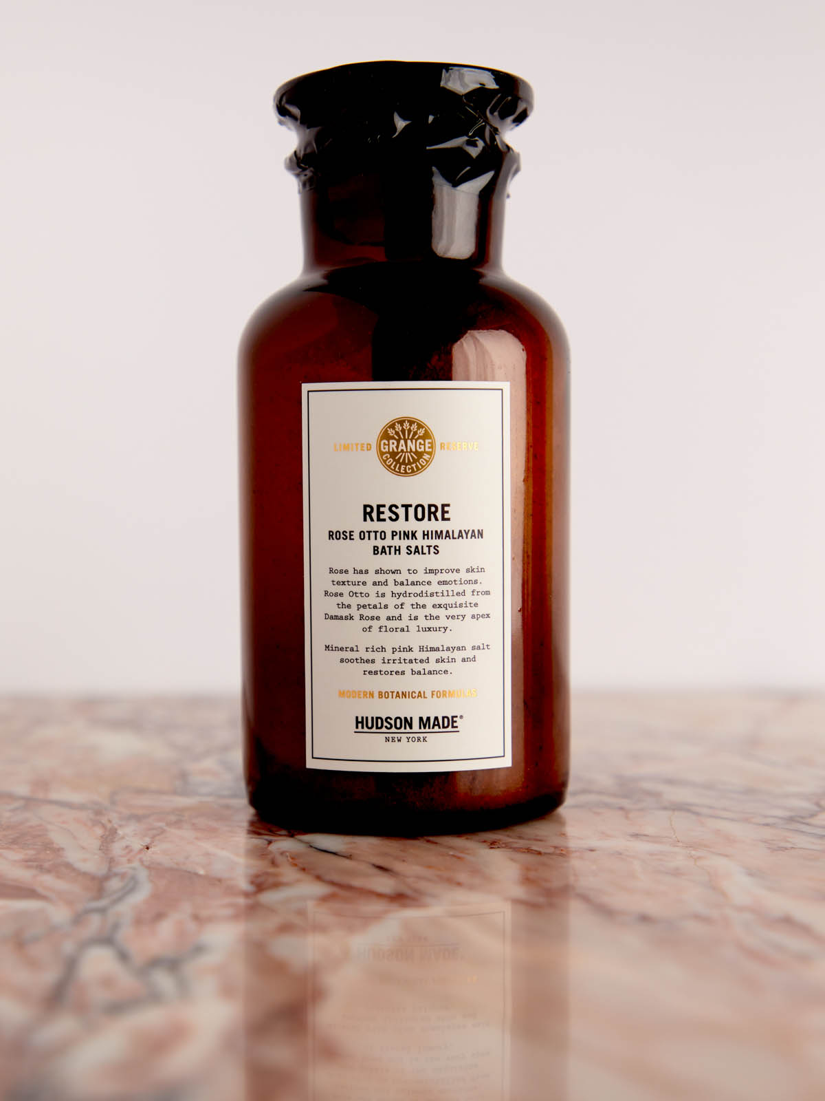Restore - Bath Salts with Rose Otto Pink Himalayan Salts in glass bottle on pink marble by Hudson Made