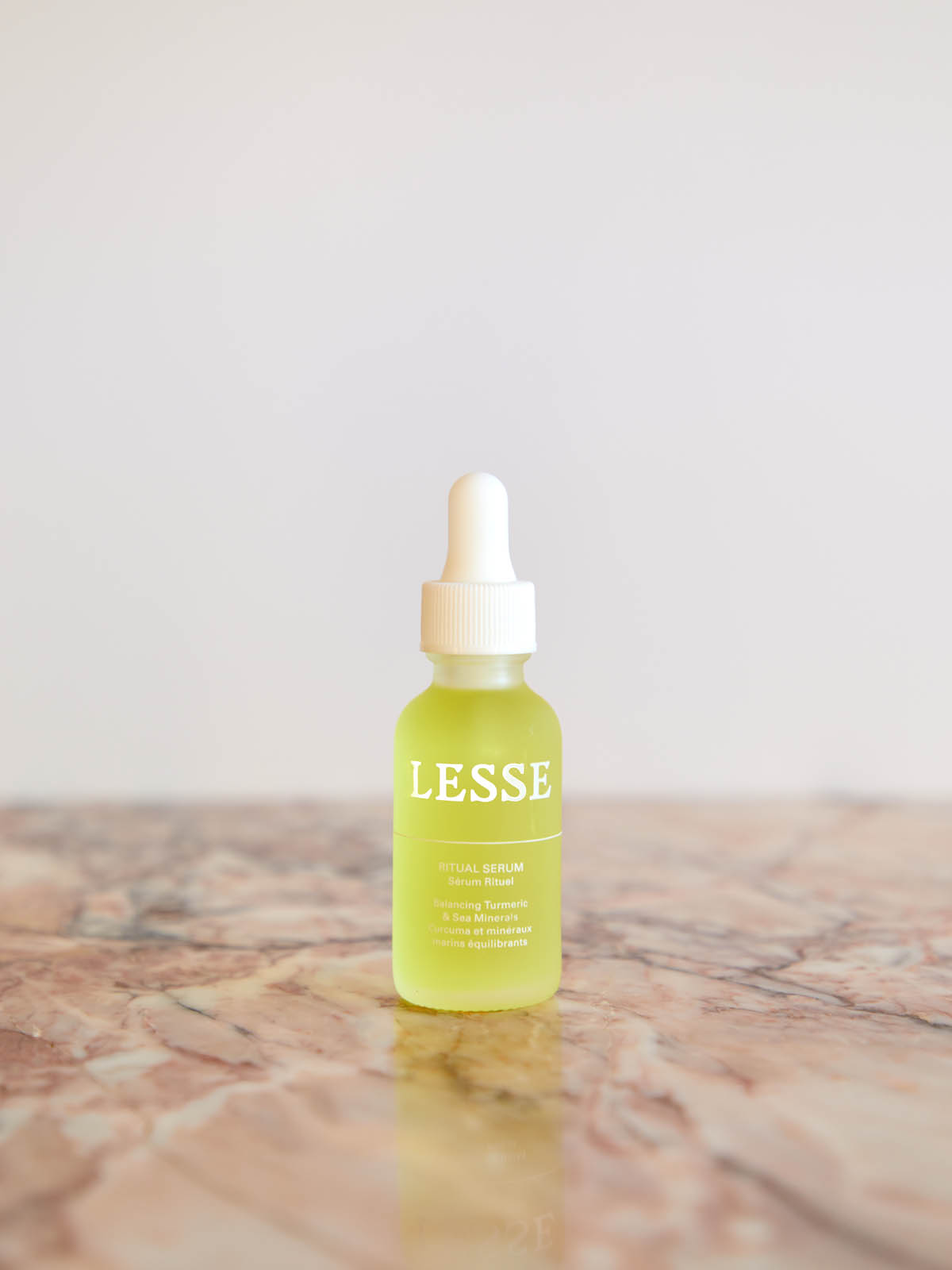 Ritual Serum on pink marble by Lesse