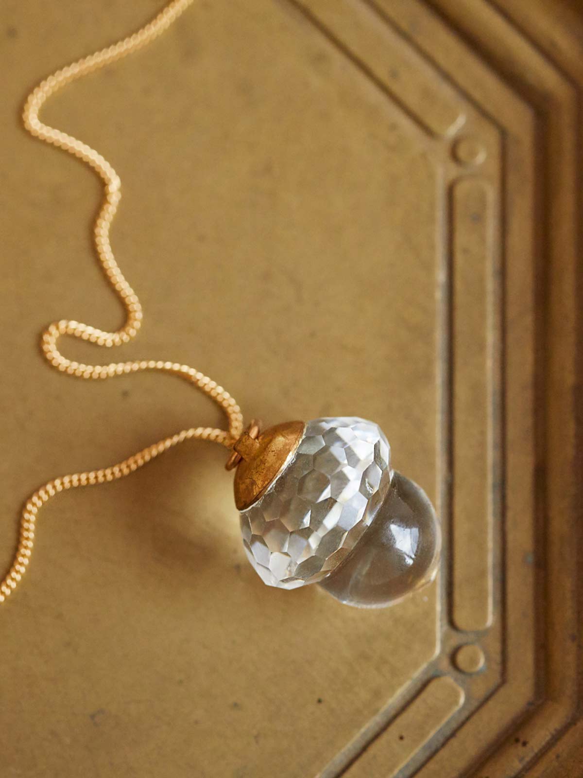 crystal acorn pendant on tray