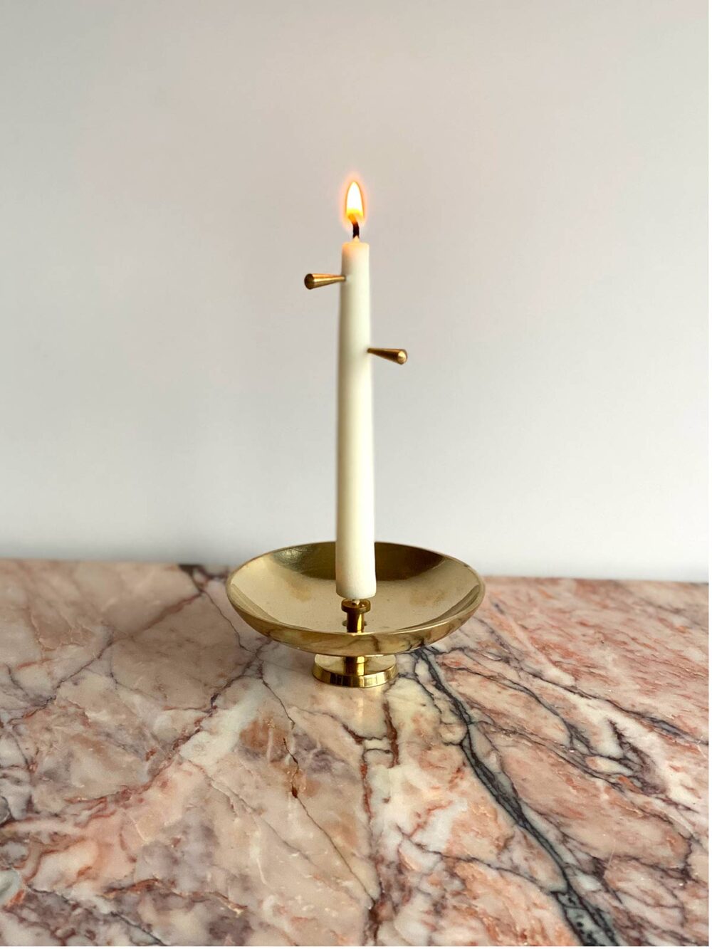 Bell Candle Set on pink marble