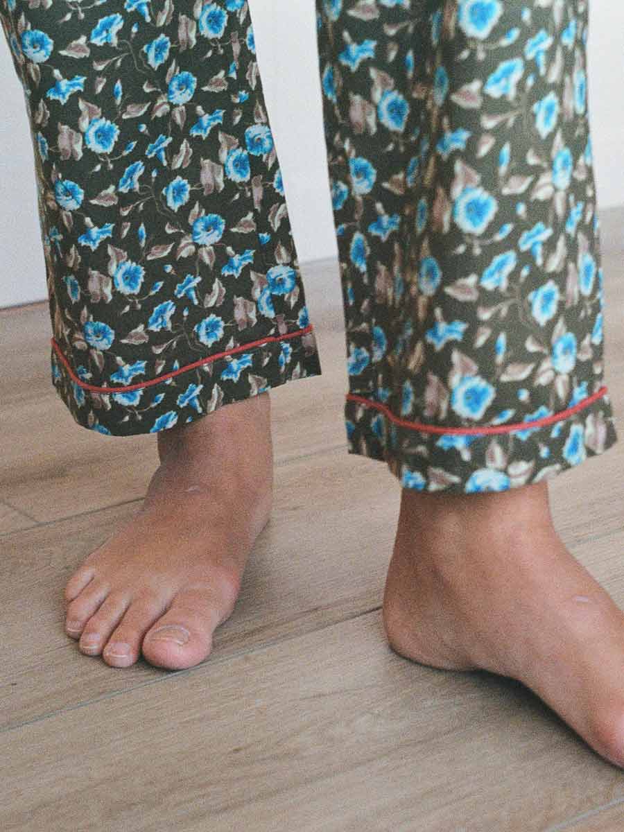 close up of ankles with domi patterned pjs