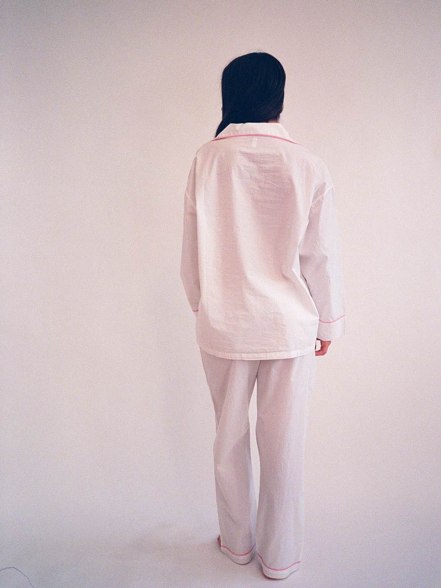 woman wearing domi oversized embroidered pjs - back view