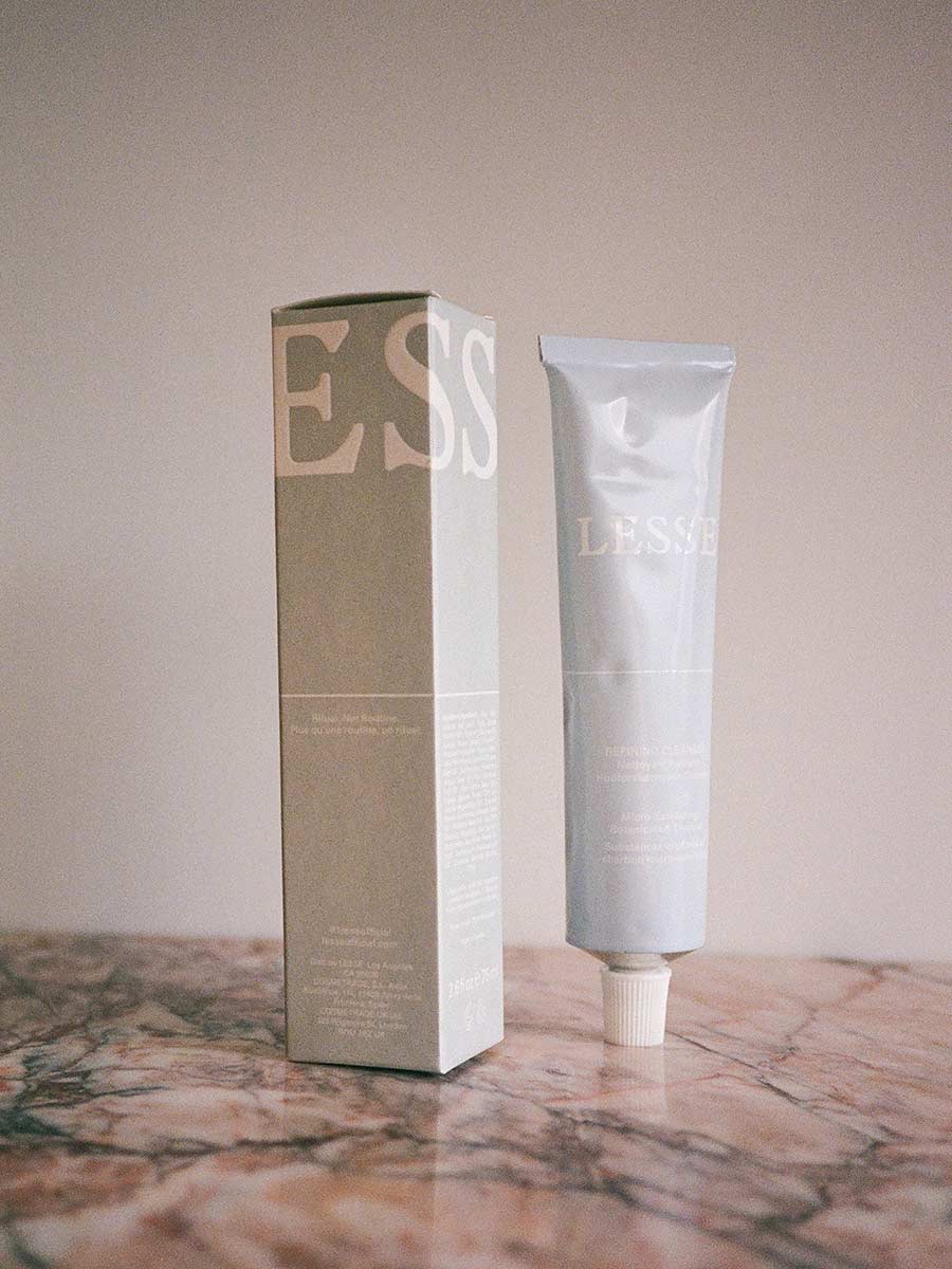 Refining Cleanser by Lesse on pink marble with box