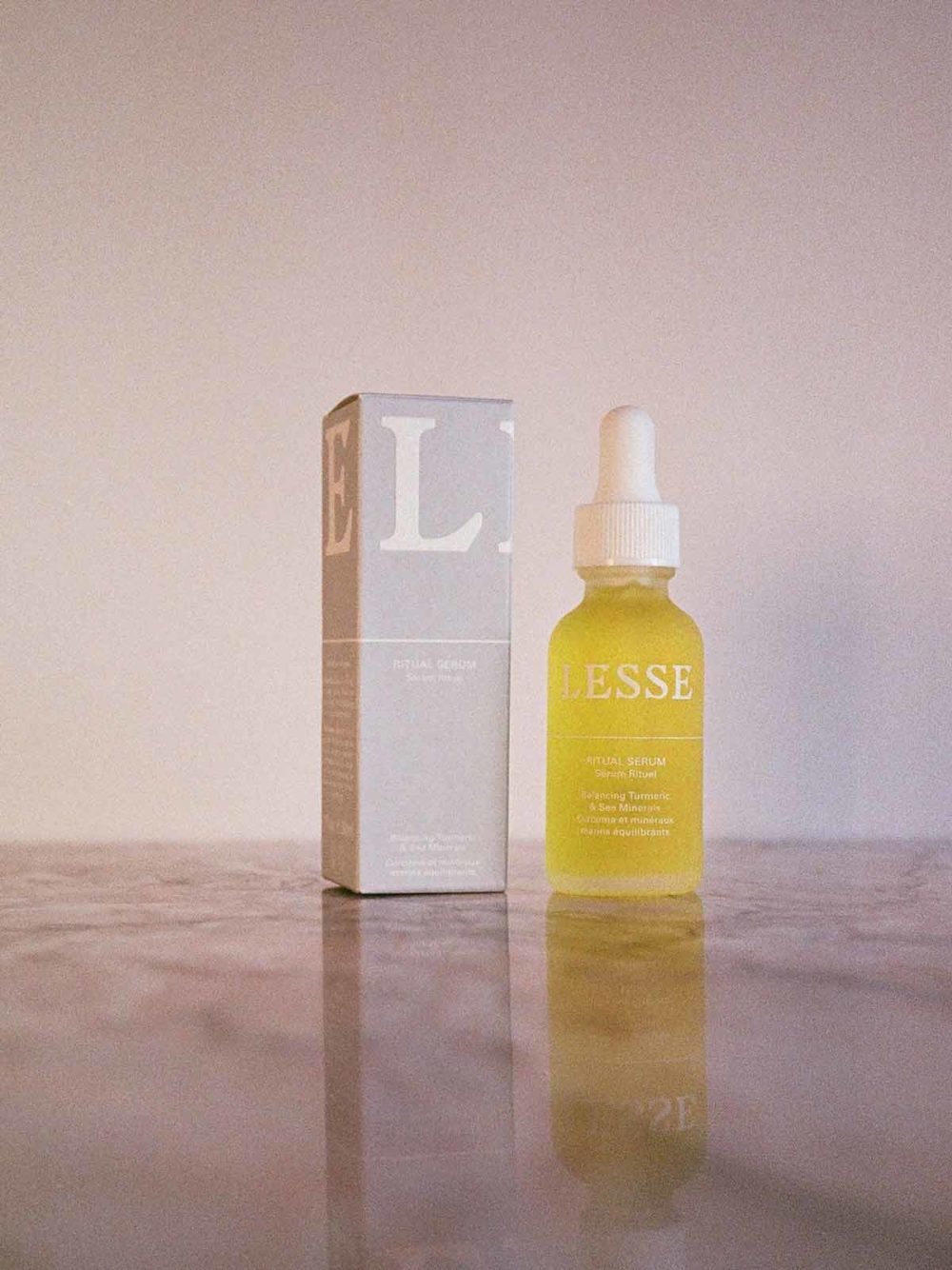 Ritual Serum and box on pink marble by Lesse