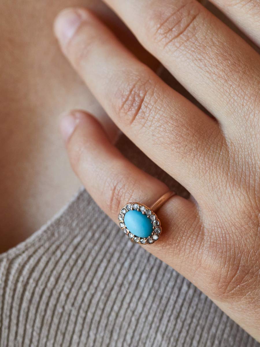 turquoise with diamond ring on pinky finger